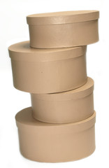 A pile of round boxes against a white background