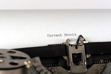 typewriter typing current events close up