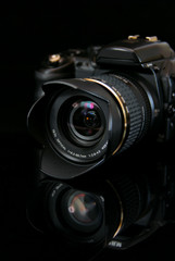 modern profesionalny camera SLR on the black background