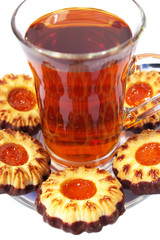 Cookies whith jelly and tea on a white background