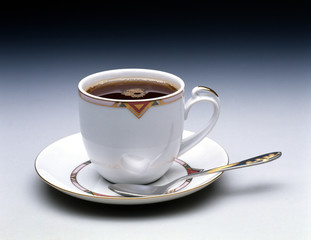 Cup of hot black tea on  black  background. 
