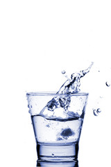 Close up view of the splash in water (toned in blue)