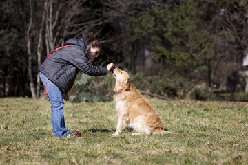 Girl playing with her dog