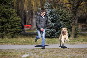 Girl playing with her dog