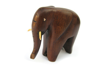 Naklejka premium Elephant wooden figurine isolated in white studio