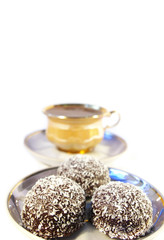 Cup of coffee and sweet with a coco  isolated
