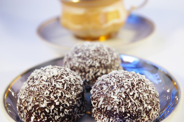 Cup of coffee and sweet with a coco