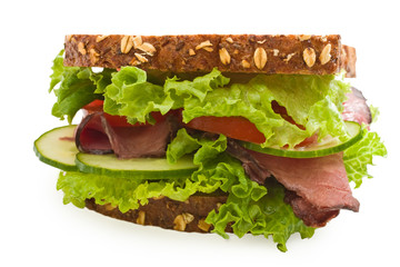 Multi-grain angus roast beef sandwich isolated on white