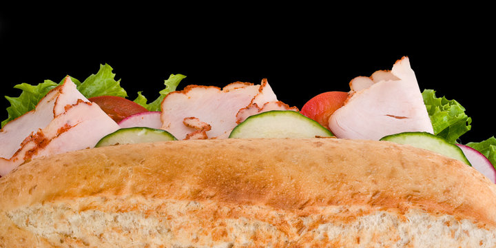 Turkey sandwich top view on black background