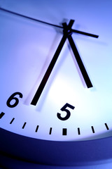 Closeup of hands on clock face