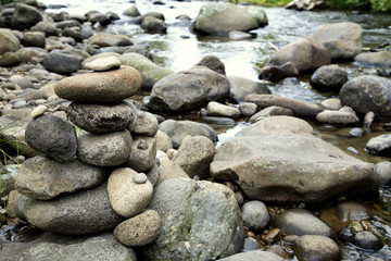Stack of rocks next to stream