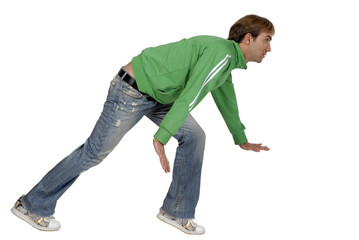 casual young man crouching