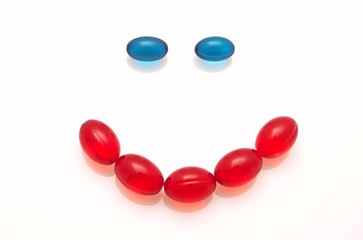 Smile made of red pills 