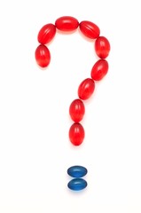 Question mark shaped from capsules