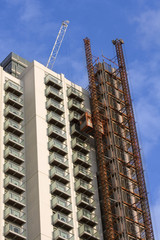 Fototapeta premium Construction site with crane and unfinished building
