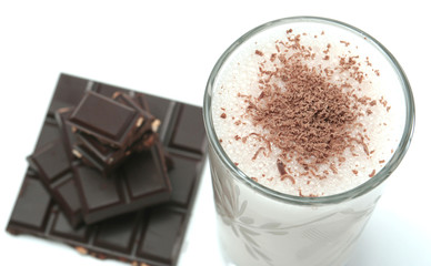 Glass with dairy chocolate drink on a white background