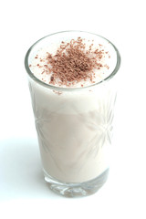 Glass with dairy chocolate drink on a white background