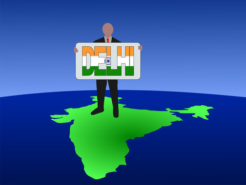 man on map of India with Delhi sign