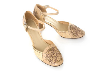 Beige female shoes on a white background