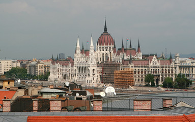 Obraz premium Parliament in Budapest with roofs of Buda