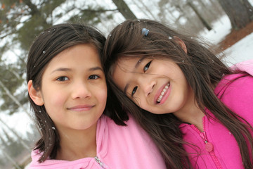 Obraz premium Two girls enjoying the winter