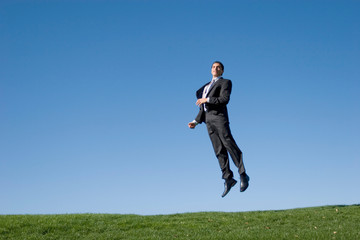 Businessman jumping