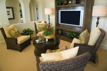 Living room with an HDTV and comfortable lounge chairs.