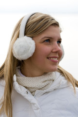 Smiling girl in headset ear muffs
