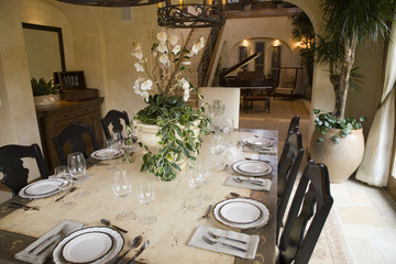 Dining room and table with luxurious decor.