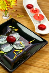 Still life with candle and petals of flower