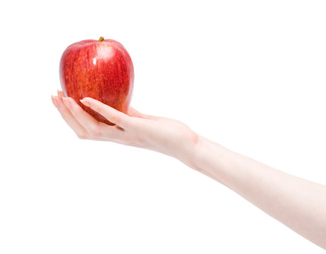 Woman hand holding red apple