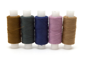 Coils of colour threads isolated on white