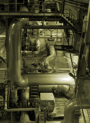 Equipment, cables and piping as found inside of a modern industr