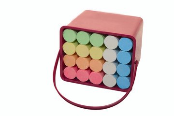 Colored crayons in plastic container.