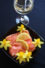 Salmon sandwich with a glass of white wine