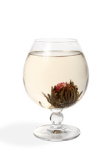 Glass with a flower green tea