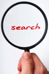 word SEARCH under magnifying glass