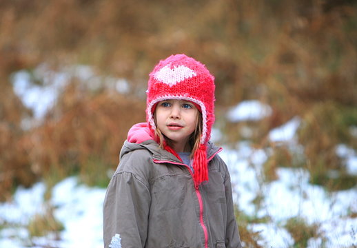 Child Frowing in the Snow