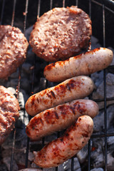 food meat  sausages and burgesr on barbecue. Shallow dof.