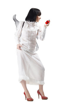 Gothic angel brunette girl holding perfume