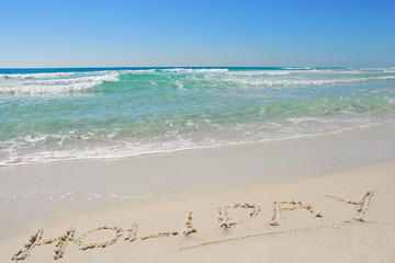 Holiday Written in Beach Sand
