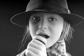 Young Girl Singing Into Microphone