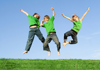happy smiling healthy group of kids jumping