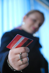 businesswoman holding credit card