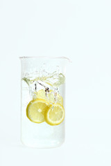 Lemon splashing into water
