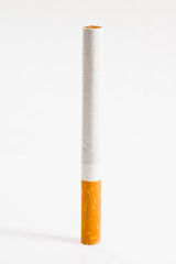 Cigarette on white.