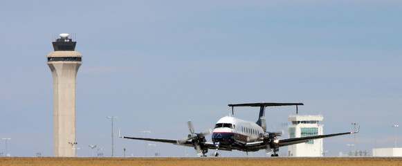 double propeller plane on runway