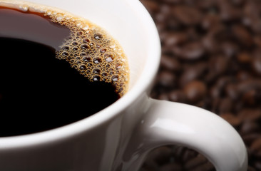 cup of coffee and coffee beans