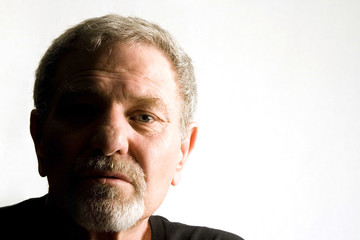 Close up on the face of a baby boomer - Isolated