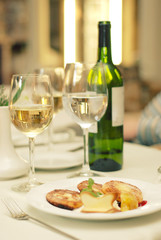 Wine bottle with glasses on table in restaurant